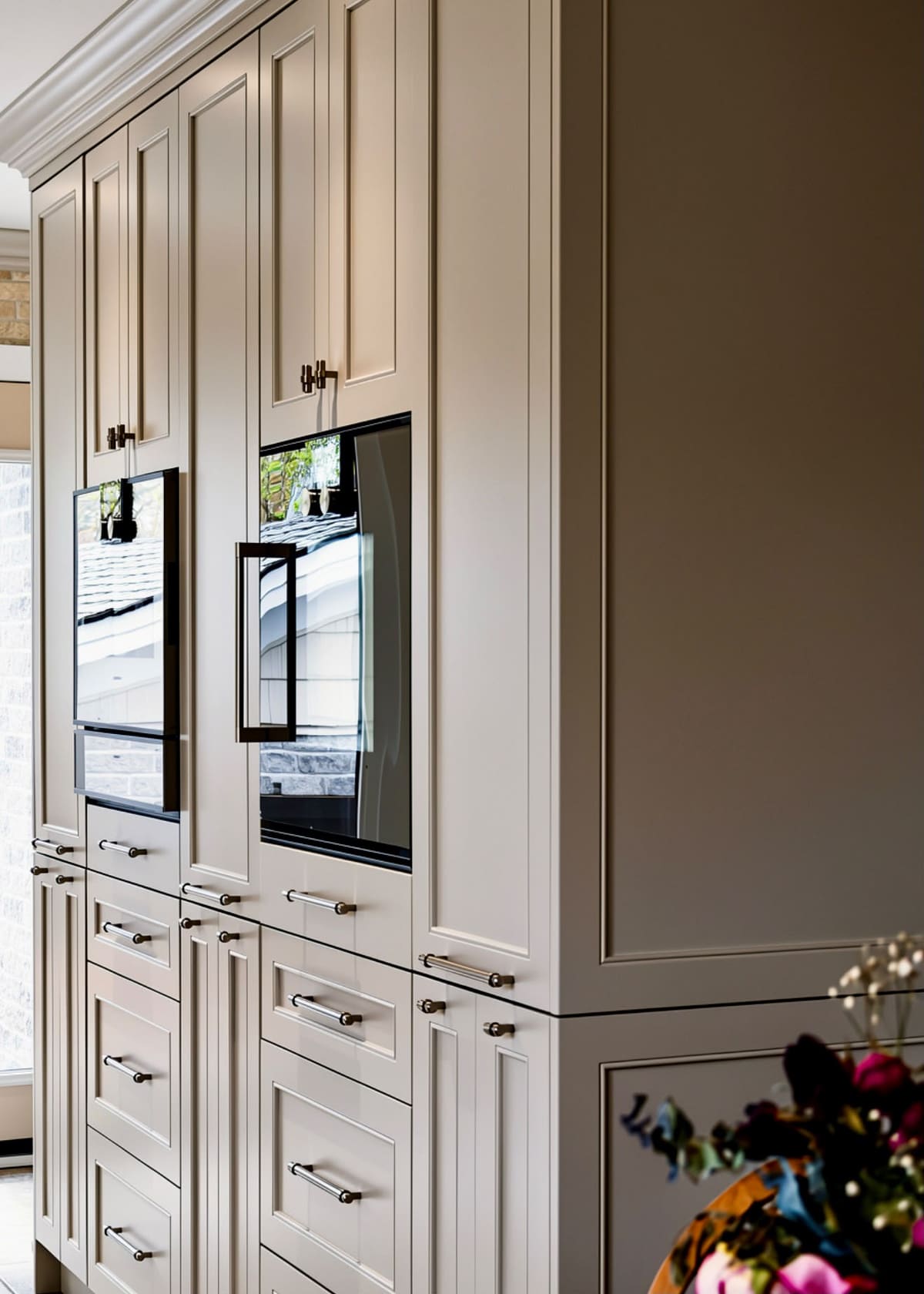 Full-height panelled cabinetry with built-in wall ovens, designed, built and installed by Brampton Kitchen & Cabinets