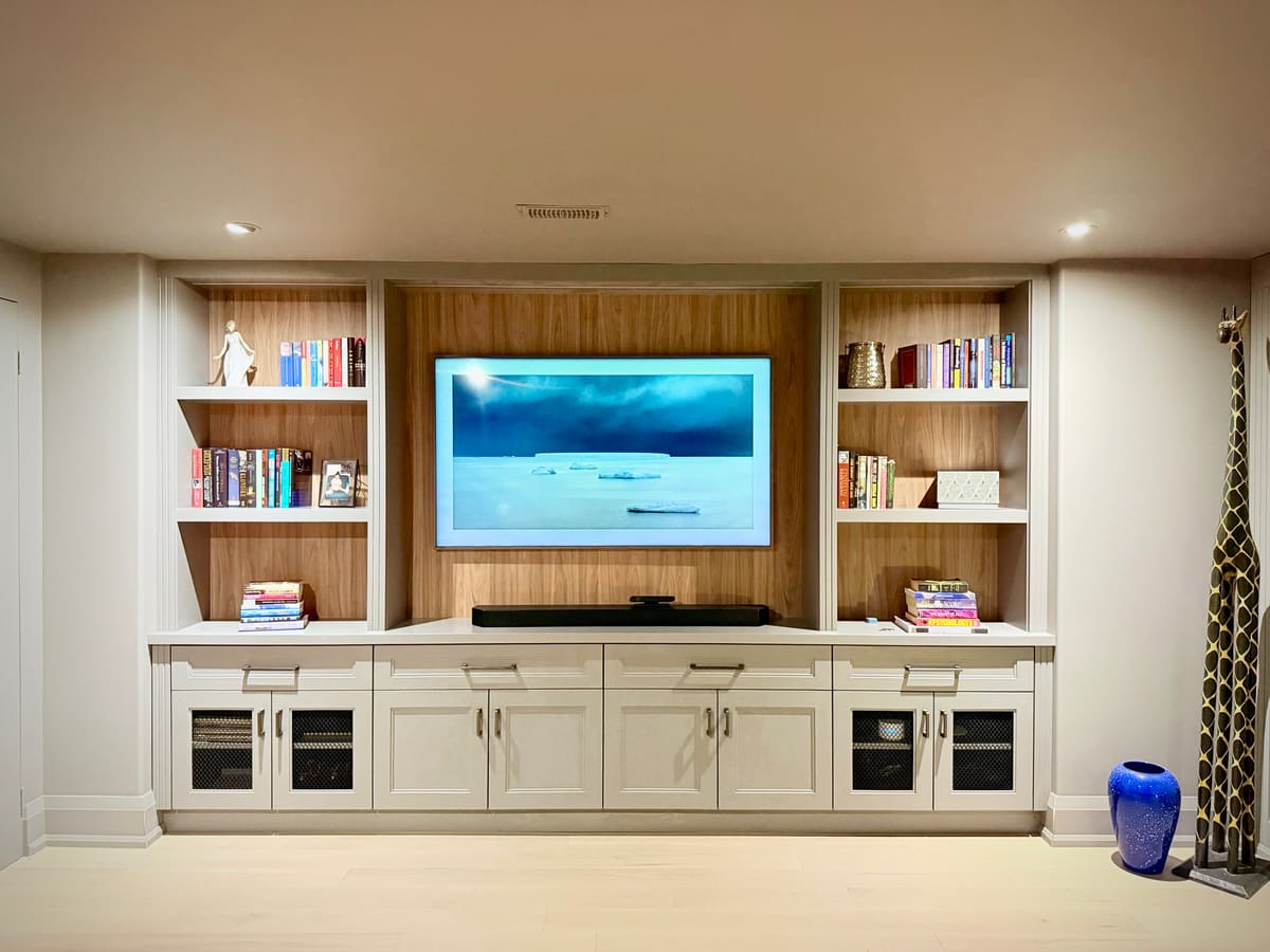 Wood and white media wall with built-in bookshelves