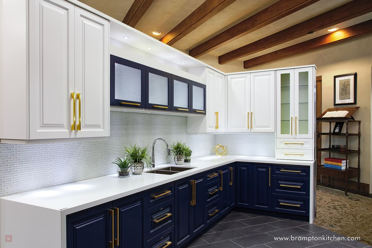 Two-tone navy and white kitchen with brass pulls and wood ceiling beams