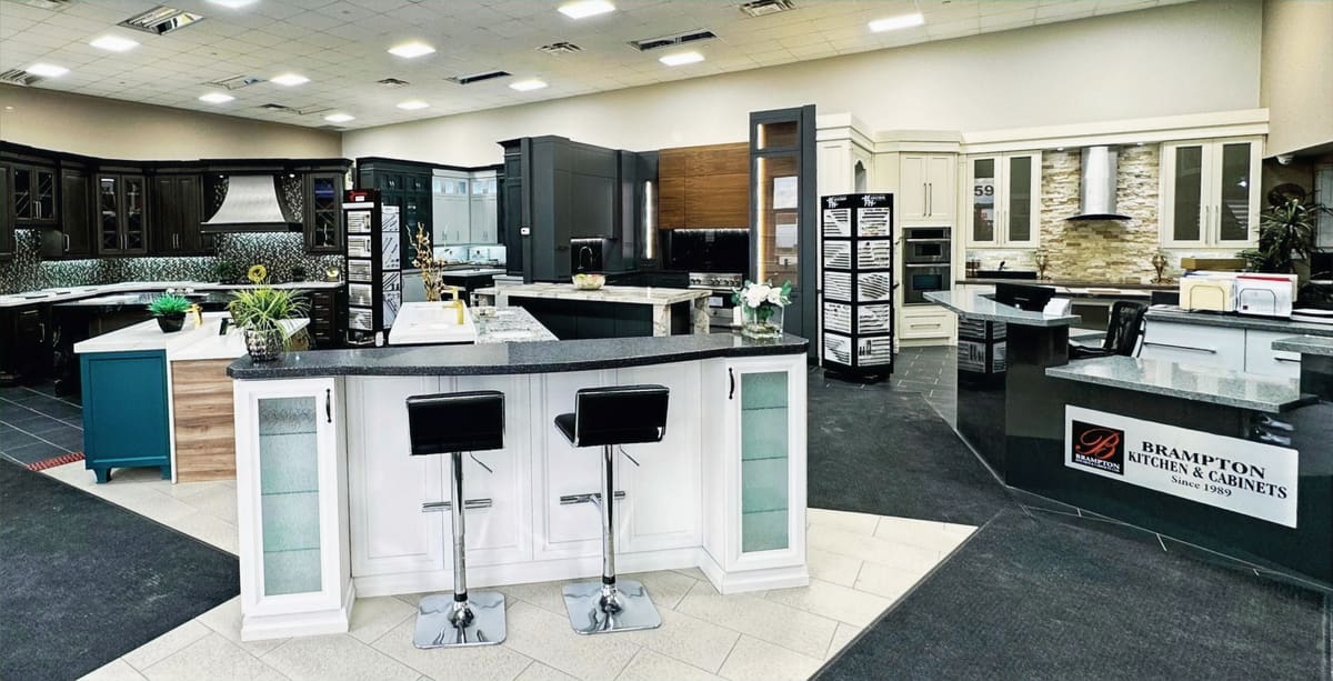 Inside the Brampton Kitchen & Cabinets showroom with display kitchens and islands